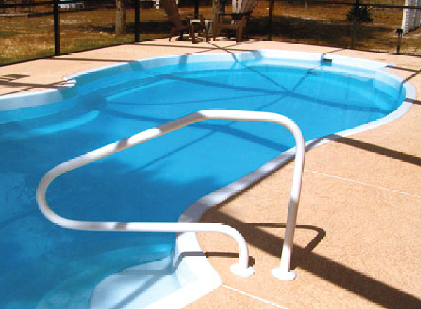 Inground fiberglass pool with a railing